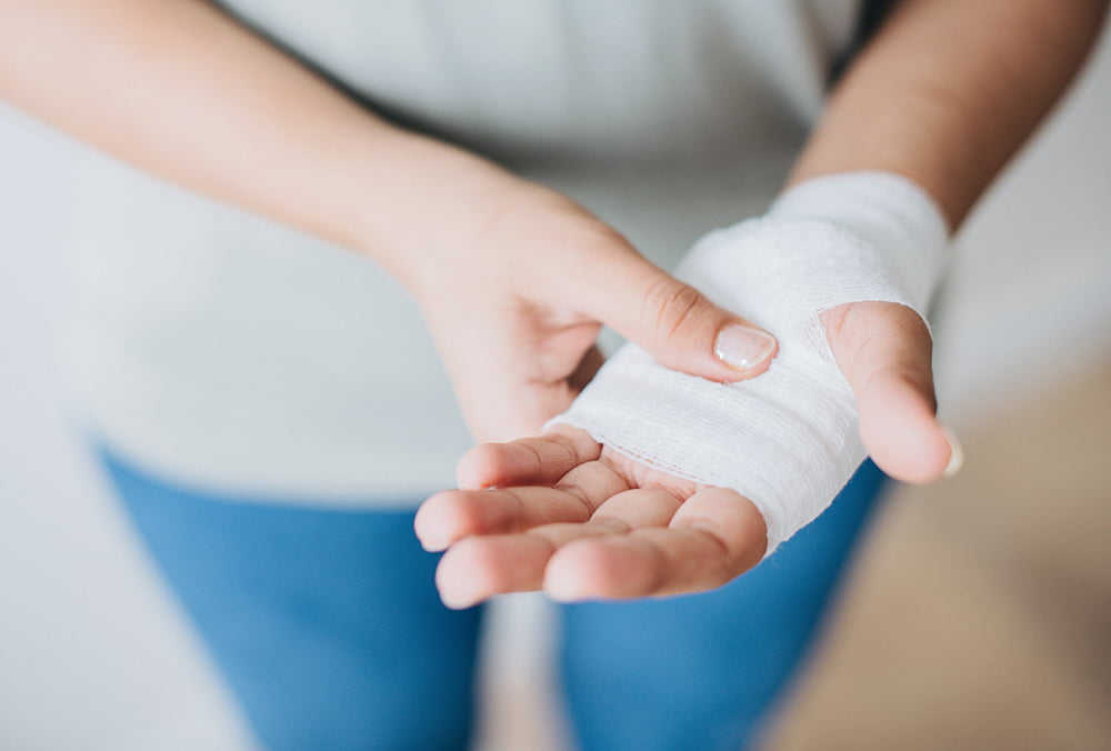 Patient with bandage over hand