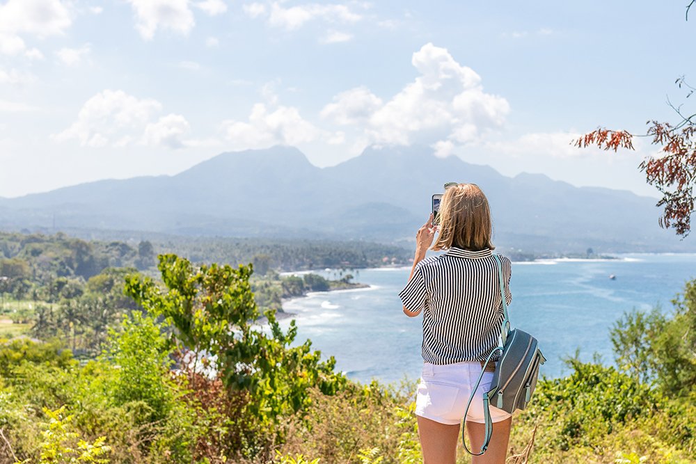Woman taking a photo of scenery